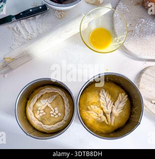 Preparing easter bread dough decorated with wheat and berries Stock Photo