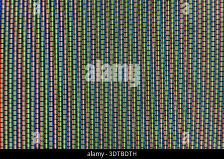 Analog TV Screen Close Up Texture. RGB dots seamless pattern, revealing digital display structure through vibrant red, green, blue color fragments Stock Photo