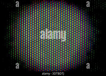 Analog TV Screen Close Up Texture. RGB dots seamless pattern, revealing digital display structure through vibrant red, green, blue color fragments Stock Photo