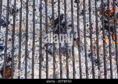 Used charcoal briquettes on barbeque grill Stock Photo