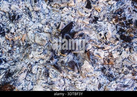 Used charcoal briquettes on barbeque grill Stock Photo