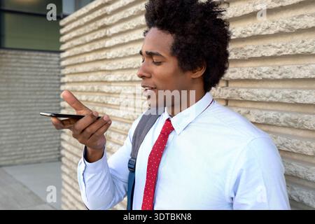 Assured corporate specialist confidently highlights groundbreaking tactics outdoors Stock Photo