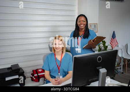 Diverse medical team members working in a healthcare office Stock Photo