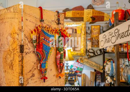 Arkansas, SEP 21 2024 - Colorful patterned umbrellas hang on vintage map screen. Stock Photo