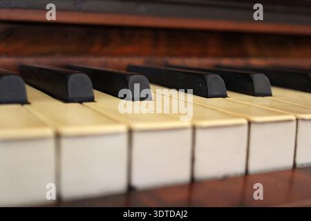 Close up of black and white piano keys on an old musical instrument Stock Photo