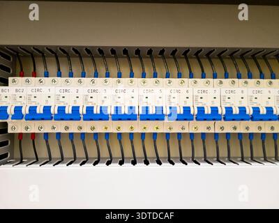 Industrial electrical control panel with wiring and circuit breakers Stock Photo