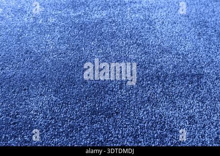 Classic blue carpet texture close up, indoors interior design, color trend of 2020 Stock Photo