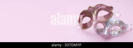 Carnival masks on pink background, banner with copy space Stock Photo
