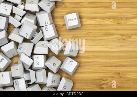Old computer keyboard keys on the wooden table background. Computer repair, service. Copy-space Stock Photo