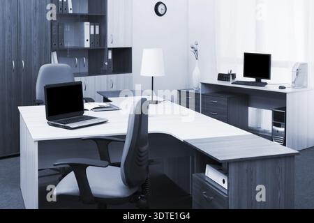 Workplaces with computers in a modern office Stock Photo
