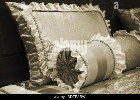 Beautiful silk cushions on the beds of modern Stock Photo