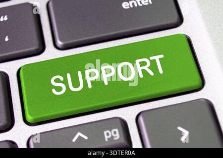 Support text on laptop keyboard button. After service support concept Stock Photo