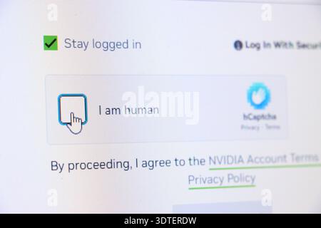 Checkbox selected for stay logged in and I am human text on screen. Captcha and security concept for online authentication. Stock Photo