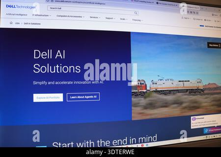 Computer monitor showing Dell AI Solutions website with text and train image. AI innovation concept for technology. Stock Photo
