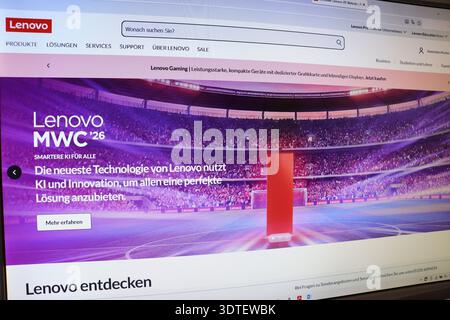 Computer screen displaying a website with a large stadium image and German text for artificial intelligence solutions Stock Photo