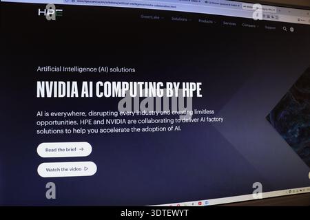 Computer screen displaying an editorial webpage about AI solutions by companies. Modern technology for artificial intelligence computing. Stock Photo