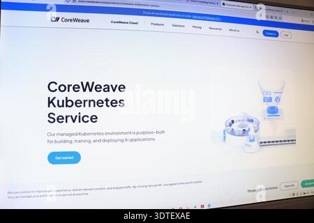 Desktop computer screen displays CoreWeave Kubernetes Service website with AI applications concept. Digital information technology for business. Stock Photo