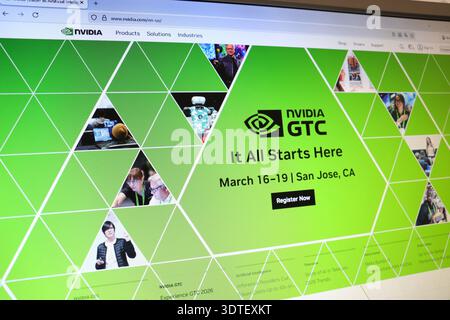 Website page for a technology conference shown on a computer monitor. Concept of an upcoming tech event and digital registration. Stock Photo