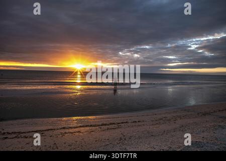 Man fishes along Tigertail Beach at sunset on Marco Island, Florida Stock Photo