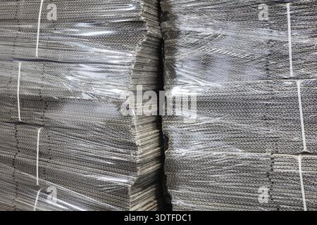 Corrugated cardboard packaging in cellophane Stock Photo