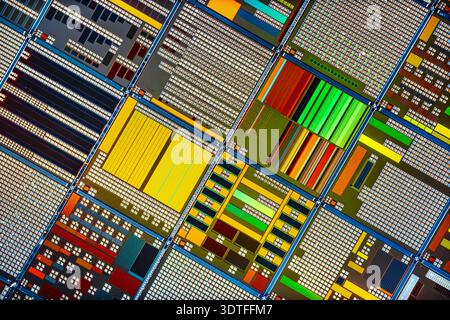 Detailed view of patterned silicon semiconductor wafer showing many ...