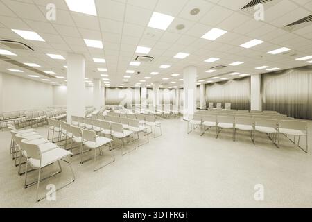 Large and modern white auditorium with curtains Stock Photo