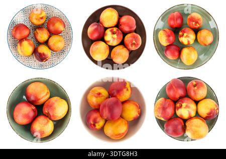 Large collection  overhead views of ripe nectarines and peaches served in various colorful ceramic plates and bowls. Vibrant red and yellow stone frui Stock Photo