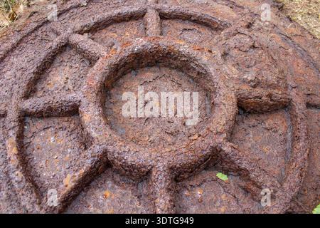 close up of big rusty hatch for sewer pit Stock Photo