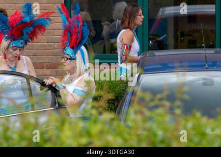 Dancers from the Suffolk School of Samba at the annual Framlingham Gala parade through the Suffolk market town assemble in a car park beforehand. Stock Photo