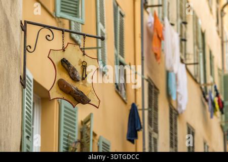 Vintage Shoemaker Street Sign on Old Building Wall in Nice Stock Photo