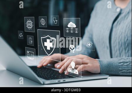 Healthcare and Medical Technology Concept. Person using laptop with virtual medical interface icons, representing digital health, AI, telemedicine, Stock Photo