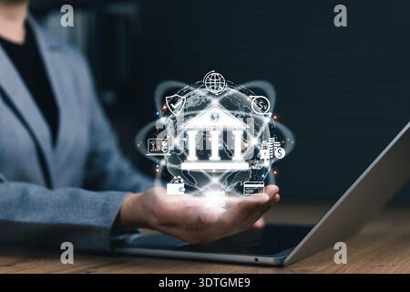 Digital banking and financial technology concept. Businessperson presents icon of bank with financial symbols, representing digital banking services, Stock Photo