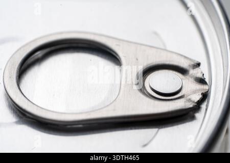 Close-up of a closed metal jar lid with an opening ring, on a white background, perfect for food packaging concepts. High quality photo Stock Photo