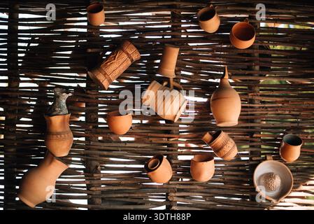 Clay jugs hang on the fence Stock Photo