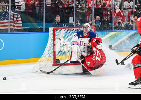 Connor Hellebuyck (USA),Macklin Celebrini (CAN) during the Winter