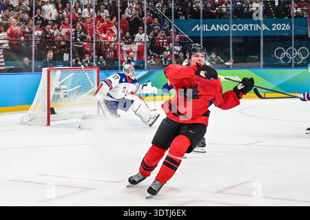 Connor Hellebuyck (USA),Macklin Celebrini (CAN) during the Winter