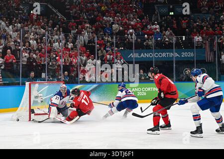 Connor Hellebuyck (USA),Macklin Celebrini (CAN) during the Winter