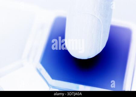 High-resolution conceptual image of a robotic hand pressing a button, symbolizing artificial intelligence, automation, and digital control systems. Id Stock Photo