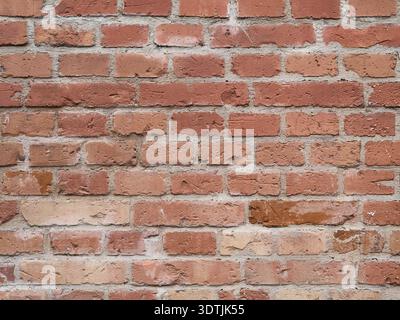 Detailed texture of an old weathered red brick wall. Stock Photo