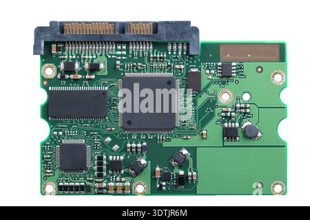 Printed circuit board, PCB of a hard disk drive, HDD, from above. Flat piece of layered fiberglass with copper traces, memory, and and support chips. Stock Photo
