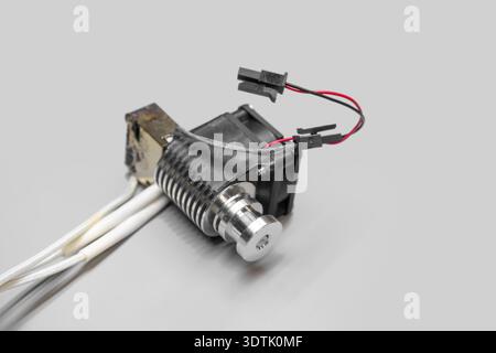 3d printer hotend assembly with integrated cooling fan and heatsink from a side view Stock Photo