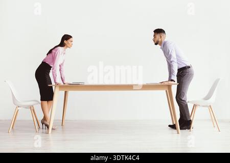 Business Meeting Between Two People Discussing Important Topics in an Office Setting Stock Photo
