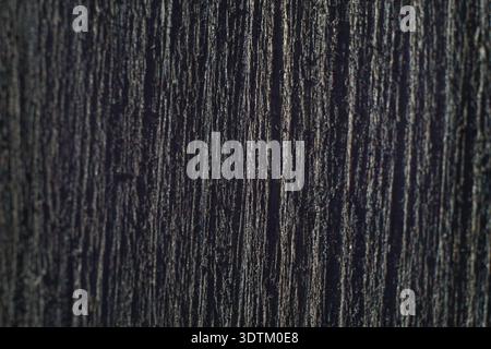 Dark-stained wood grain texture background. Stock Photo