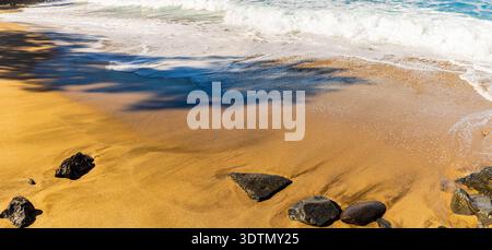 Waves Rolling in on The Sandy Shoreline of Slaughterhouse Beach, Maui, Hawaii, USA Stock Photo