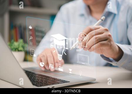 Businessman brainstorming creative ideas on futuristic education interface. Using technology online learning, skill development, and personal growth. Stock Photo