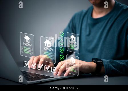 Real estate agent using technology property evaluation, comparing house quality on futuristic virtual dashboard. Customer selects home, reviewing loan Stock Photo