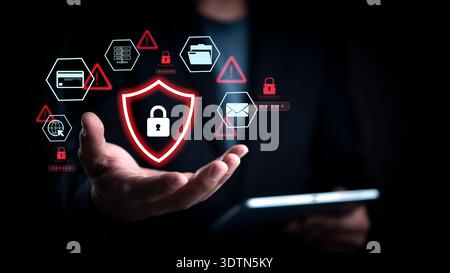 Cybersecurity threat alert concept. Man hand show red shield padlock icon. Data protection network security. Hacker attack warning. Virtual interface Stock Photo