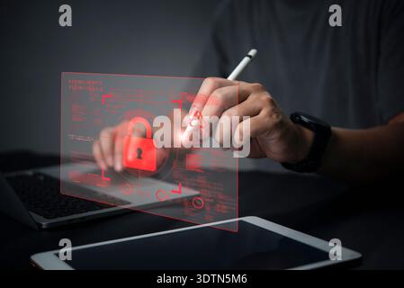 Man hand use virtual screen. Cybersecurity technology concept. Hacker attack alert warning icon. Red padlock data protection network security. Futuris Stock Photo