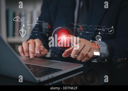 Businessman hand using laptop with virtual padlock icon for cybersecurity data protection. Network security system technology for business internet pr Stock Photo