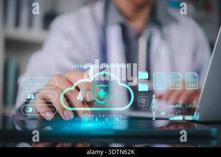 Doctor accessing electronic health records EHR via secure cloud computing. Medical data protection, analysis on tablet. Concept of digital healthcare Stock Photo